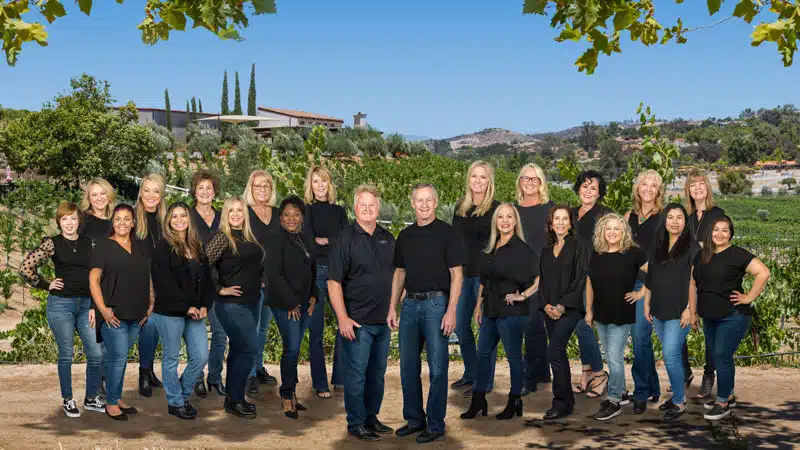 A photo of the entire Rancho Dental team in the front of the dental office
